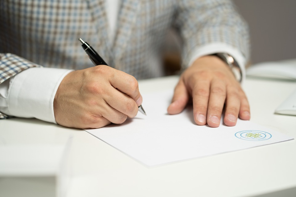 A public adjuster completing insurance claim paperwork